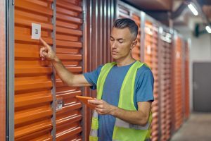 How do I prepare the shipping container for storage at my location?